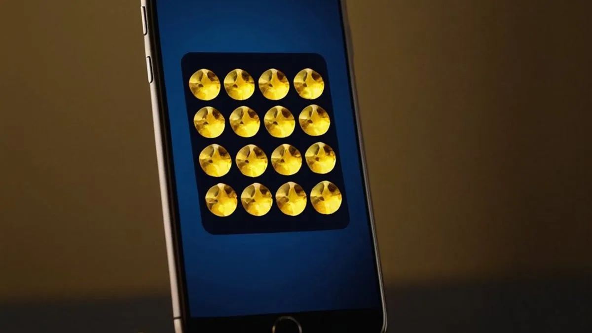 Celular en una base dorada con una cuadrícula de fichas doradas en pantalla azul